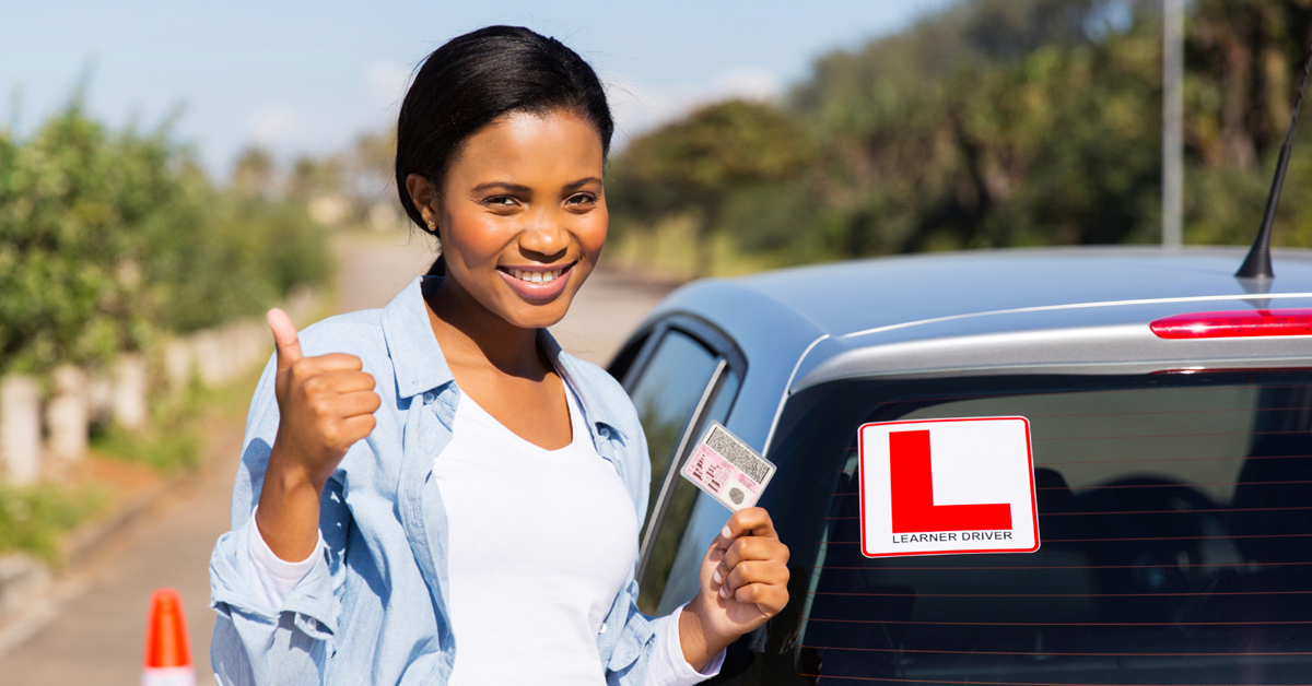 black-woman-showing-driving-license