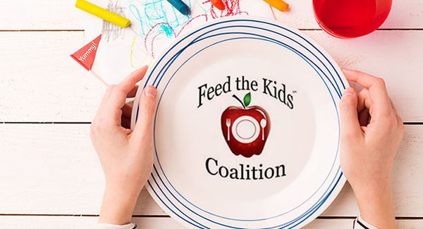 Feed the Kids Coalition logo on child's plate